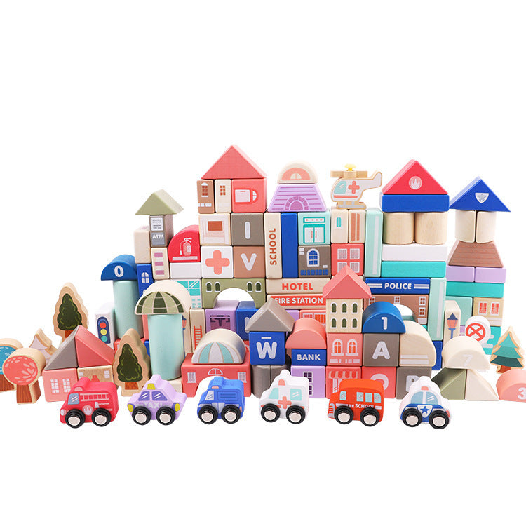 Colorful InvenToy beech wood blocks shaped like various buildings, vehicles, and trees, arranged to create a lively miniature city scene.
