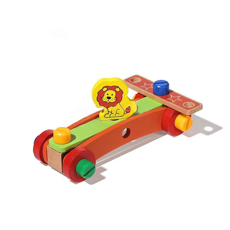 Colorful wooden InvenToy Montessori DIY Fun Chair ramp with a lion design at the top, featuring vibrant green, red, and yellow colors, placed on a plain white background.
