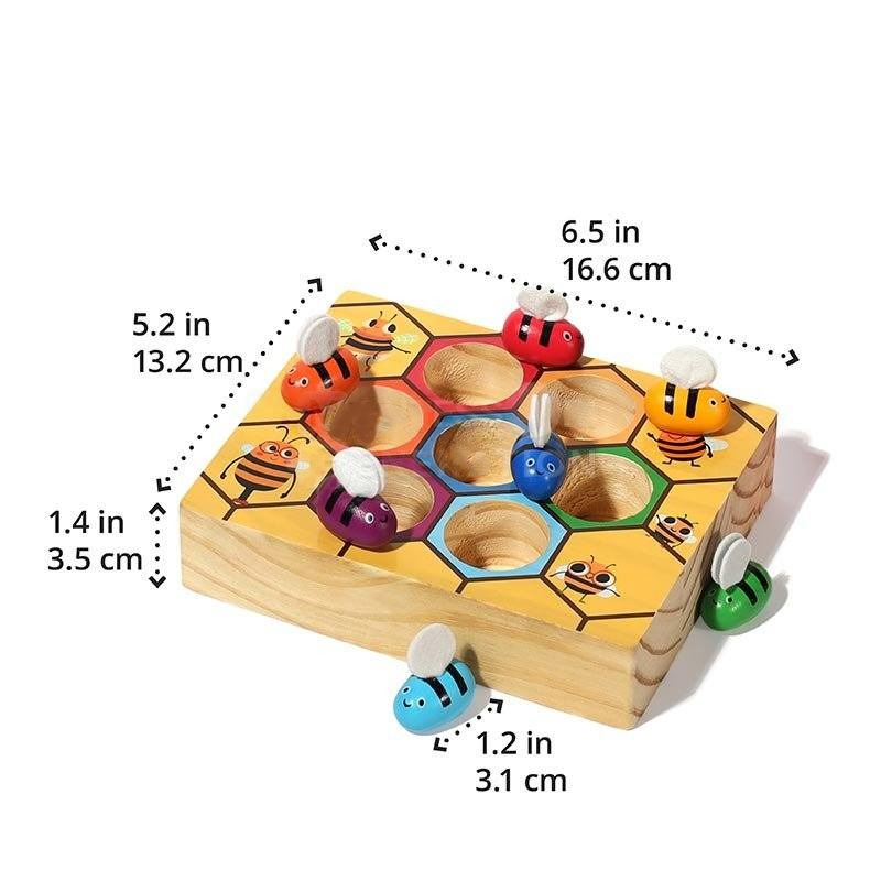 A colorful wooden Montessori Bee Box with bees and holes, each labeled with measurements in inches and centimeters, designed for children's play and learning by InvenToy.