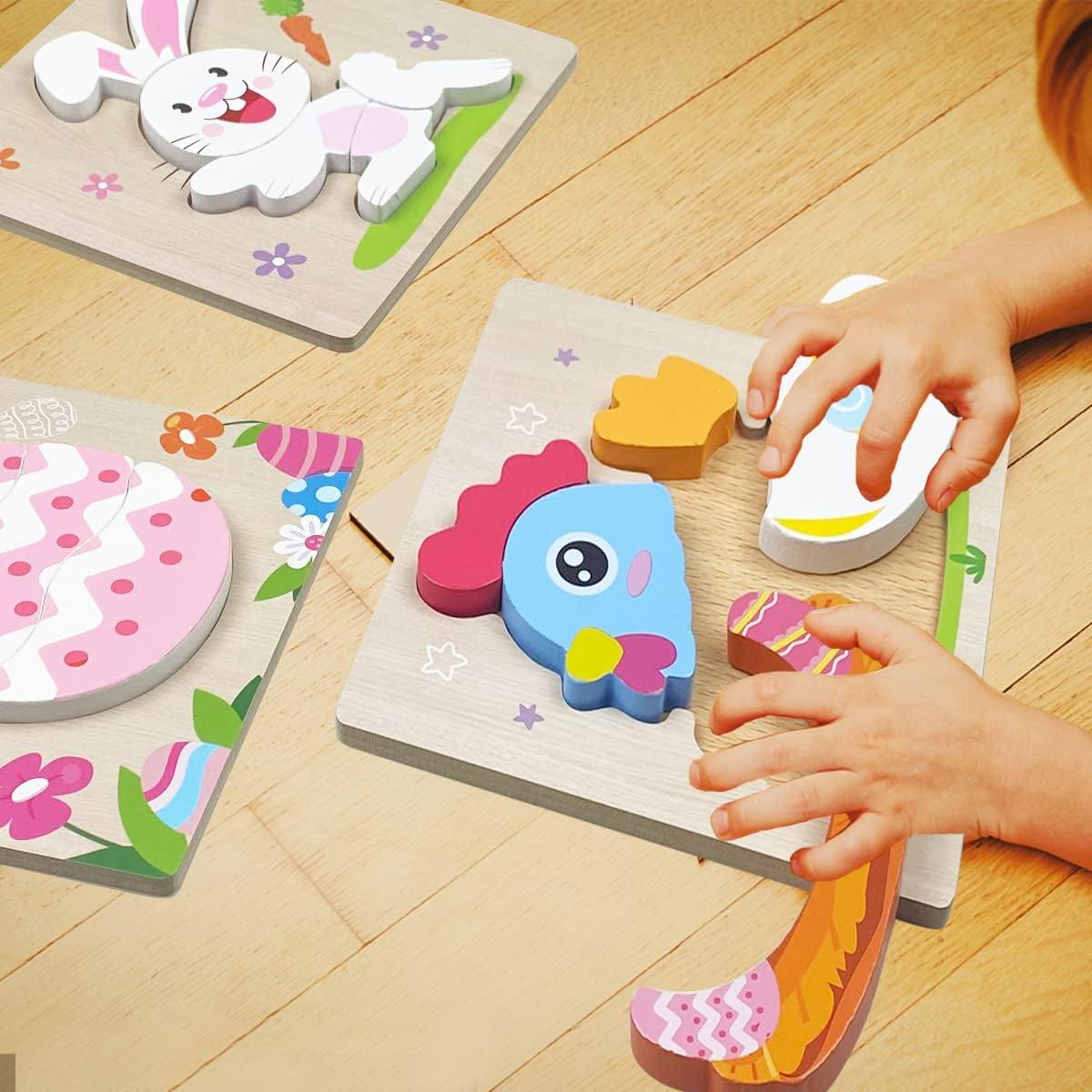 A child's hands assemble Montessori Easter Wooden Puzzles (4 Pack) with designs of a bunny, a bird, and decorated eggs on a wooden floor using InvenToy baby toys.