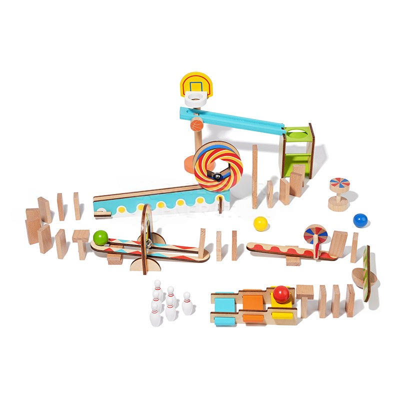 Colorful wooden Montessori Domino Run toy set composed of ramps, staircases, and tunnels with marbles positioned to start the course on a white background. This InvenToy product exemplifies Montessori baby.
