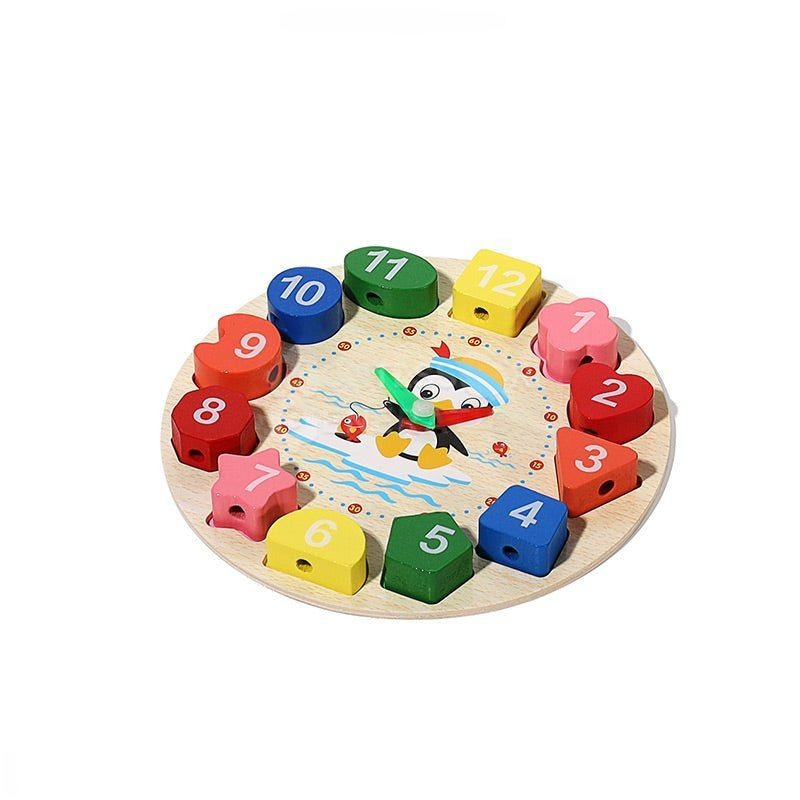 A colorful InvenToy Montessori Penguin's Clock puzzle for children, featuring numbered pieces from 1 to 12 arranged in a circle around a smiling cartoon sun, placed on a white background.