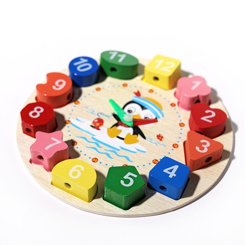 A colorful InvenToy Montessori Penguin's Clock puzzle for children, featuring numbered blocks in different colors arranged in a circle, with a playful design in the center.