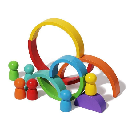 Colorful wooden Montessori Rainbow baby toys set featuring arches in rainbow colors and small figures in green, red, yellow, and blue, arranged on a white background by InvenToy.