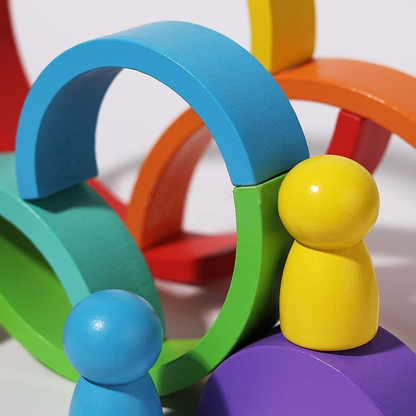 Colorful wooden InvenToy Montessori Rainbow baby toys, figures, and arches in blue, orange, red, and purple create an engaging and vibrant display of geometric shapes and contrasting colors.
