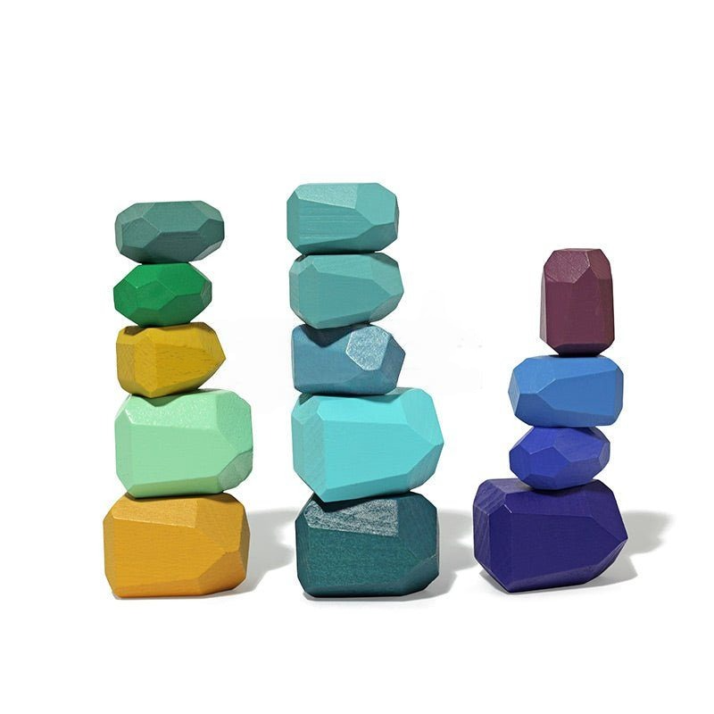 Three stacks of colorful, irregularly shaped InvenToy Montessori Wooden Stones (21 Pieces) arranged in ascending order on a white background.