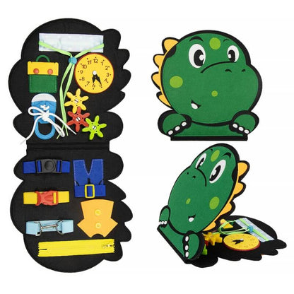 A children's Montessori educational toy featuring a green dinosaur design with various activities, including zippers, buttons, laces, and buckles, designed to develop fine motor skills. 
Product: Montessori Dino Busy Board
Brand: InvenToy