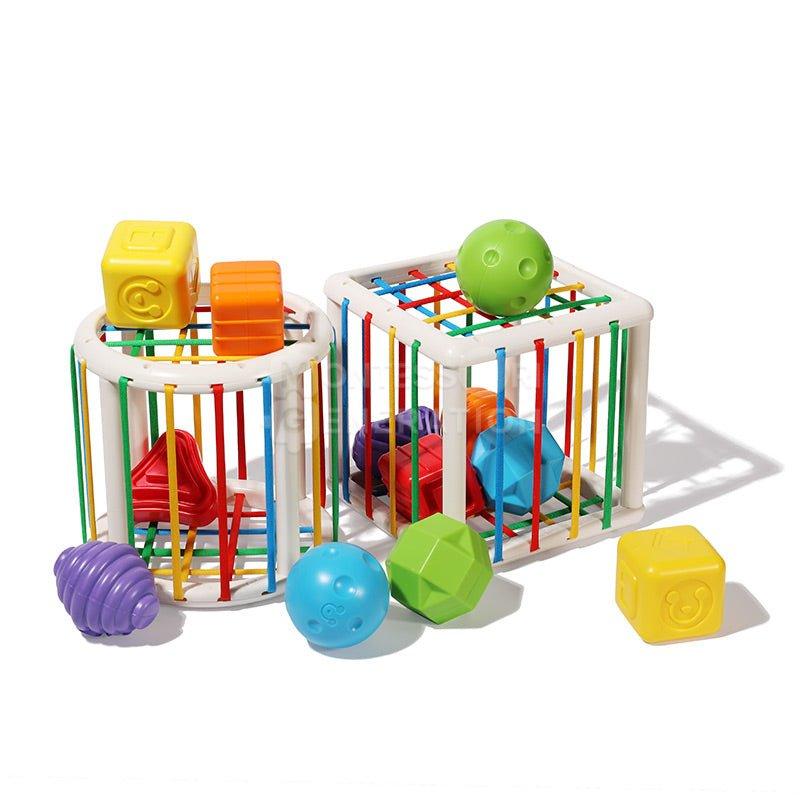 Colorful InvenToy Montessori Shape Blocks, with some encapsulated in a white cage with multicolored bars, isolated on a white background.